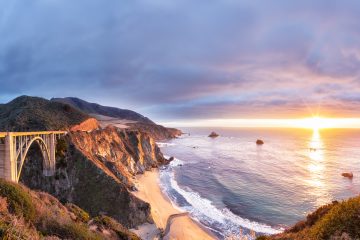 Bixby Creek Bridge on Highway 1 at the US West Coast traveling south to Los Angeles, Big Sur Area, California at sunset.