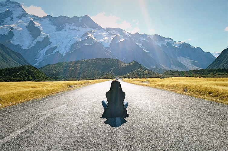 lady-sitting-in-road