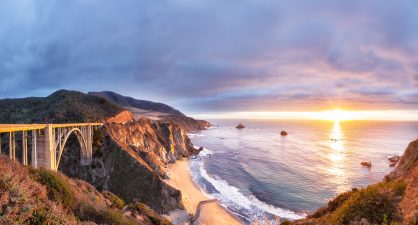 Bixby Creek Bridge on Highway 1 at the US West Coast traveling south to Los Angeles, Big Sur Area, California at sunset.